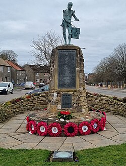 Winchburgh war memorial with remembrance wreaths